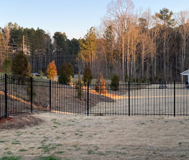 metal fence on a backyard of a house